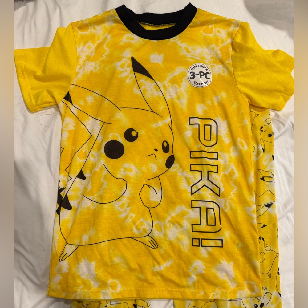 Yellow and black new boy Pokemon pjs top and pants size 12/14 large